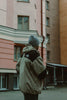Layered winter streetwear outfit with a beanie