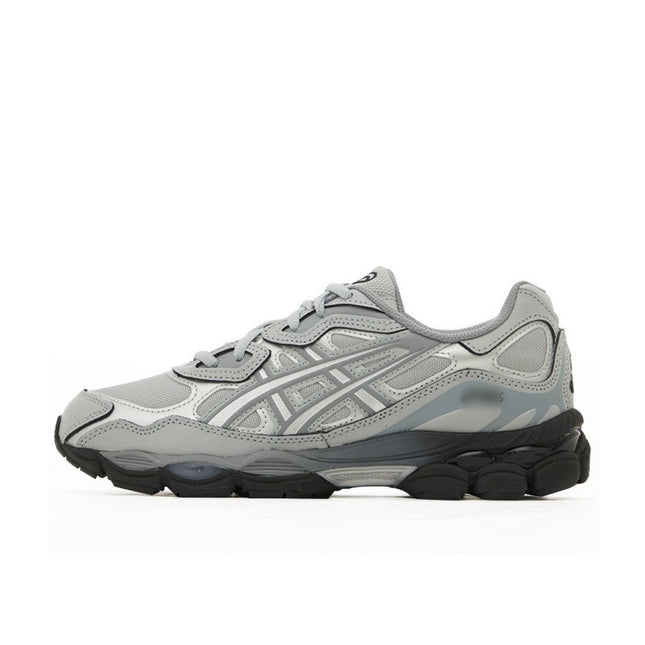 Gray sneaker with layered textures, black sole, and distinctive striped side design.
