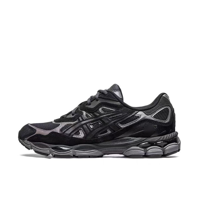 Black athletic shoe with mesh and leather textures, silver accents, and a thick, textured sole.