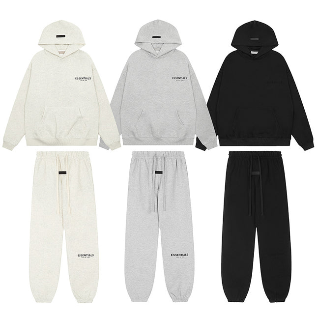 Set of three hoodies and three pairs of pants in white, gray, and black on a white background.