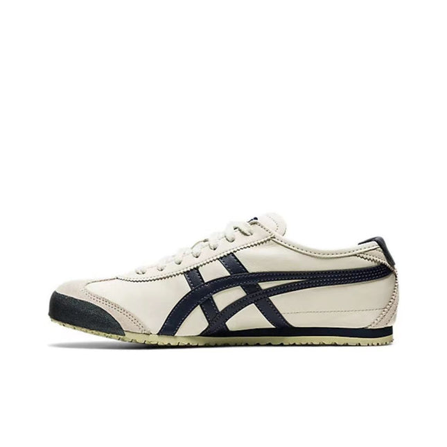 Cream sneaker with black stripes, beige sole, and black toe cap, viewed from the side.
