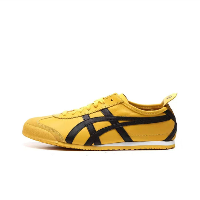 Yellow sneaker with black stripes, white sole, yellow laces, and a pull tab on the heel.