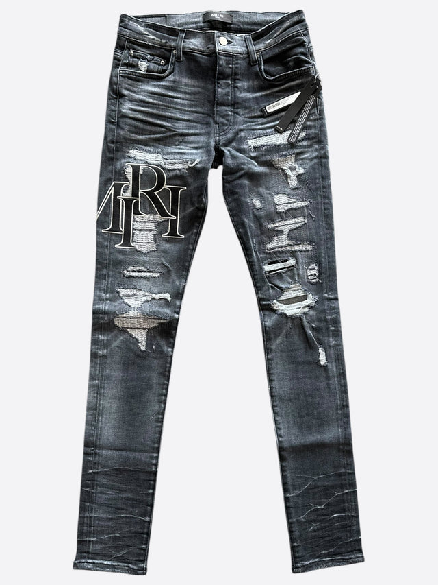 AMIRI Distressed Staggered Logo Jeans – Storm Grey / White Outline