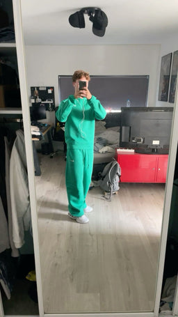 Green NOCTA Tech Fleece tracksuit streetwear look with Nike TN sneakers